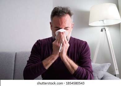 Elder Senior Man Sick At Home Sneezing