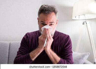 Elder Senior Man Sick At Home Sneezing