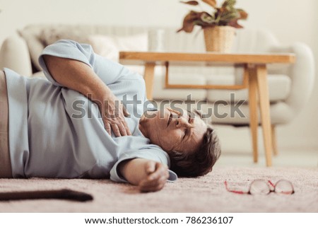 Similar – Woman lying down on a road after accident