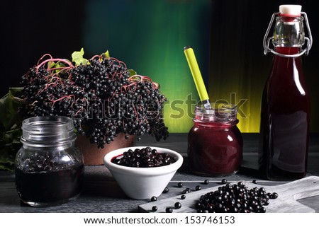 elderberry jam and berries syrup gray table green background Stock photo © 