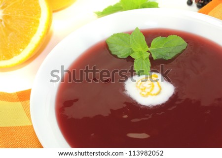 elderberry soup with dollop of whipped cream and mint on a light background Stock photo © 