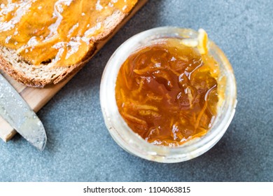 Elderflower Marmalade With Orange Peel In Jar With Bread / Jam.