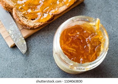 Elderflower Marmalade With Orange Peel In Jar With Bread / Jam.