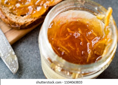 Elderflower Marmalade With Orange Peel In Jar With Bread / Jam.