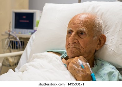 Elderly 80 Plus Year Old Man Recovering From Surgery In A Hospital Bed.