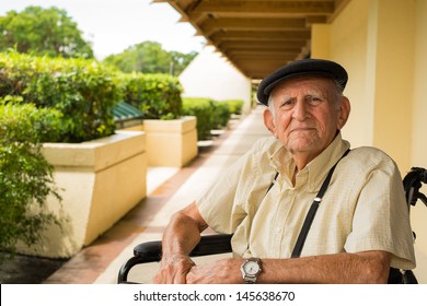 Elderly 80 Plus Year Old Man In A Wheel Chair Outdoors.