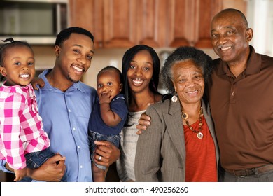 Elderly African American Man and woman posing together with their family