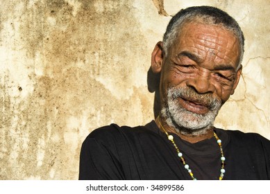 Elderly African man relaxing in the African sun
