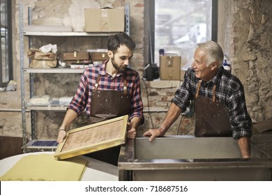 Elderly Artisan And Young Apprentice At Work
