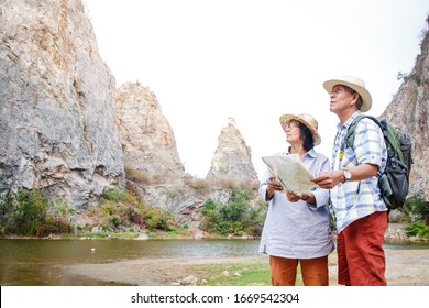 Elderly Asian Couples Trekking High Mountain Enjoy Life After Retirement. Elder Community Concept. Copy Space