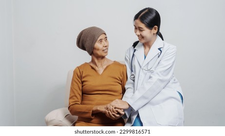 Elderly Asian female patients with cancer specialists meet by appointment to receive treatment advice for breast, cervical, lung cancer. - Powered by Shutterstock