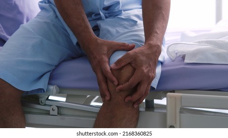 An elderly Asian male patient is hospitalized with knee pain. - Powered by Shutterstock