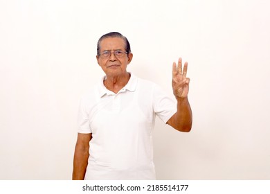 Elderly Asian Man Standing While Showing Three Fingers. Isolated On White Background