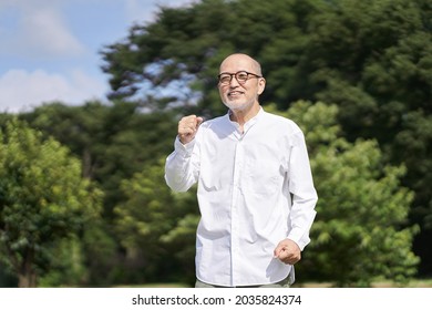 Elderly Asian Men Exercise Outside