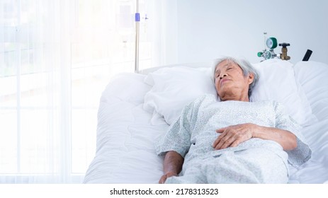 Elderly Asian Patient Sleeping On Bed At Hospital.