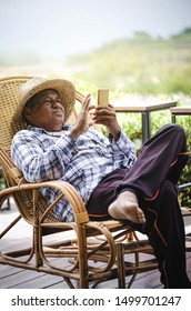 Elderly Asian People Relax Using Mobile Phones