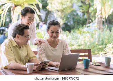 Elderly Asian, Senior couple or clients agree meeting make insurance life while Use laptop to preview, watch useful videos receive medical treatment If illness or accident occurs. retirement concept - Powered by Shutterstock