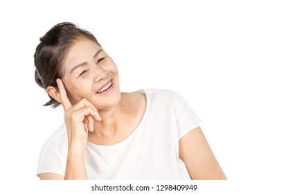 Elderly Asian Woman Portrait 60-70 Years Old With Black Hair And Hazel Eyes Looking Serious Thinking Isolated On White Background With Copy Space