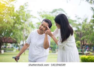 Elderly Asian Women Having A Headache And Dizzy Suffering From Migraine Disease