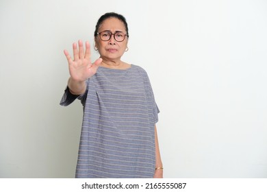 Elderly Asian Women Showing Stop Hand Sign With Serious Face Expression