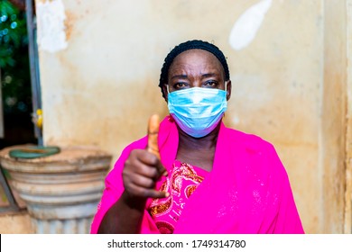 Elderly Black African Woman Wearing Face Mask  Influencing Others People To Use Face Mask When Going Out . Black Senior Woman Doing A Thumps Up Sign