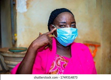 Elderly Black African Woman Wearing Face Mask  Influencing Others People To Use Face Mask When Going Out