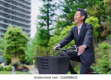 Elderly Businessman Bicycling to Work
