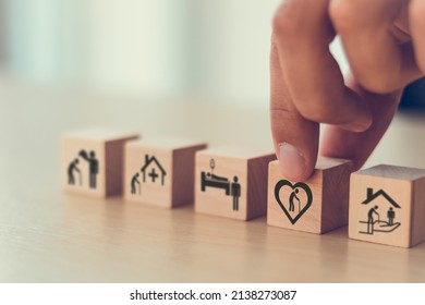 Elderly Care Concept. Holding Wooden Cube Smart Flat Design With Icon Related To Elderly Care, Medical, Rehabilitation Service, Nursing Care For Enhancing Quality Of Life In Elder Age. Care Banner.
