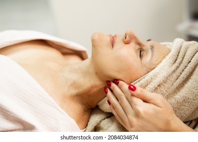 Elderly Caucasian Female On Facial Massage	