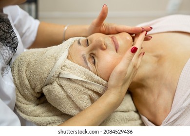 Elderly Caucasian Female On Facial Massage	