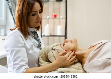 Elderly Caucasian Female On Facial Massage	