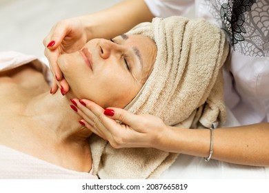 Elderly Caucasian Female On Facial Massage	