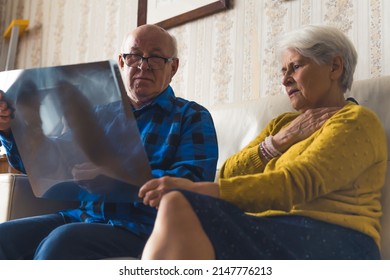 Elderly Caucasian Heterosexual Couple Worried About Lungs X-ray Results. Healthcare Concept. High Quality Photo