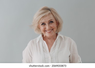 Elderly Caucasian Old Aged Woman Portrait Gray Haired Smiling Portrait. Concept Of Affordable Dentures And Implants