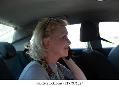 Elderly Caucasian Old Aged Woman Take Taxi Car Vehicle Ride And Speaking Mobile Phone