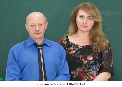 Elderly Couple. A Bald Little Man And A Big Tall Woman. Adults.