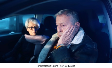 Elderly Couple In The Car Confused With Flashing Police Lights. Speeding Ticket. Man And Woman Having Argument In The Car. High Quality Photo