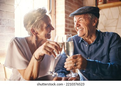 Elderly couple with champagne toast in restaurant together for anniversary. Senior man and woman with alcohol drink celebrating love, family and marriage. Celebration and cheers to being married - Powered by Shutterstock