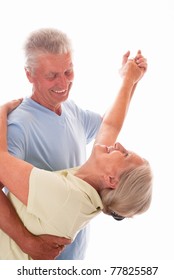 Elderly Couple Dancing On A White Background