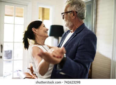 An Elderly Couple Is Dancing Together