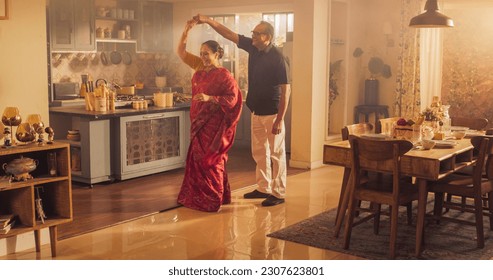 Elderly Couple DancingKitchen and Enjoying Each Other's Company: Moving to the Rhythm of Musicand Love, With Smiling Faces and Loving Embrace, Celebrate Anniversary - Powered by Shutterstock