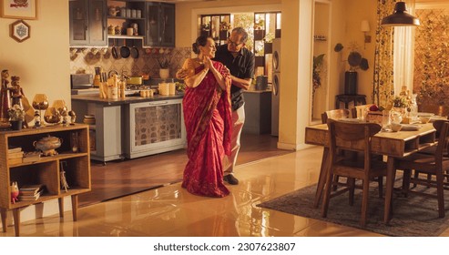 Elderly Couple DancingKitchen and Enjoying Each Other's Company: Moving to the Rhythm of Music and Love, With Smiling Faces and Loving Embrace, Celebrate Anniversary - Powered by Shutterstock