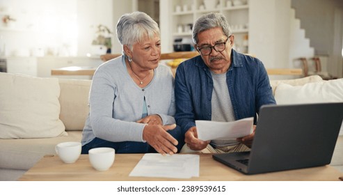 Elderly, couple and documents for financial planning in home with laptop, internet and reading for account balance. Senior man, woman and discussion with tech, webpage or online banking for budget - Powered by Shutterstock