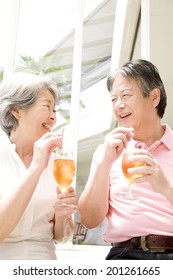 An Elderly Couple Drinking Iced Tea