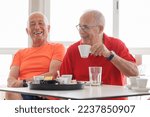 elderly couple friends have a coffee at the bar