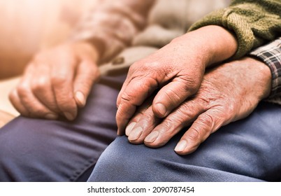 Elderly Couple Holding Hands Close Up