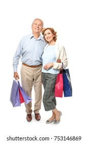 Elderly Couple Holding Shopping Bags On White Background