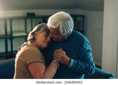 elderly couple hugging and dancing at home - relationship affection and love concept  - Powered by Shutterstock