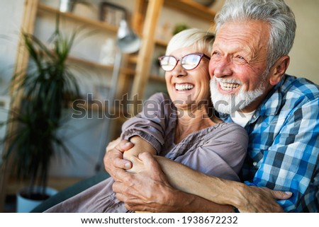 Elderly couple in love. Senior husband and wife hugging and bonding with true emotions