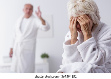 Elderly Couple With Marital Problems Arguing In Bedroom